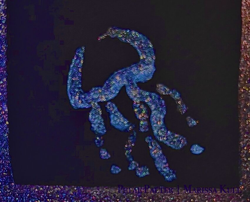 Jellyfish outline in metallic blue on black paper.