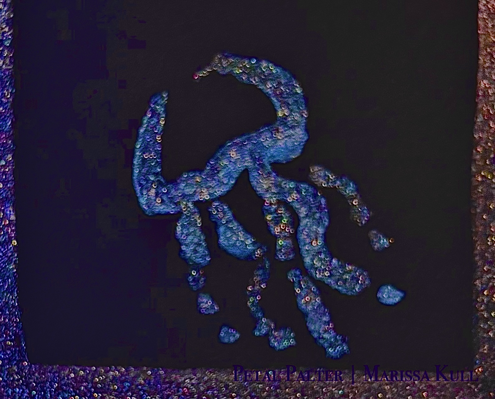 Jellyfish outline in metallic blue on black paper.