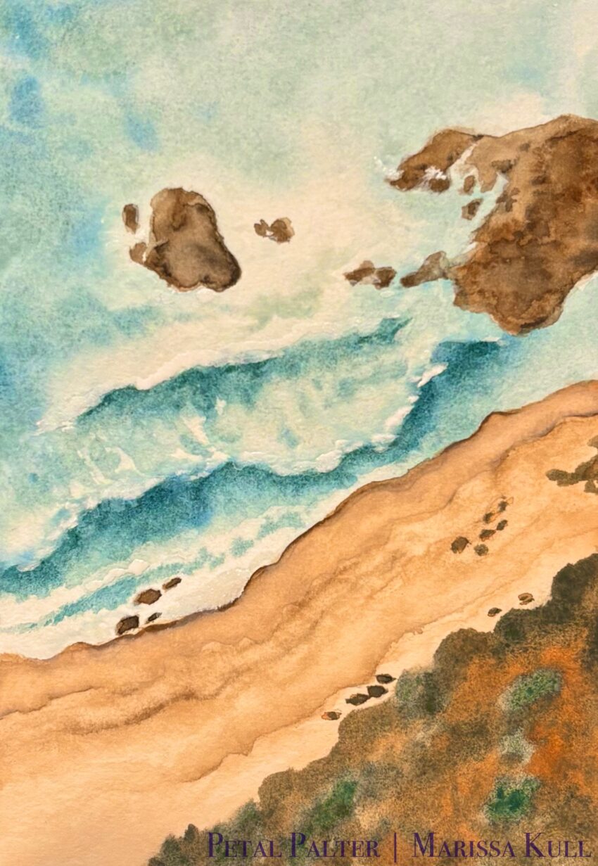 Overhead view of waves rolling into a rocky coastline.